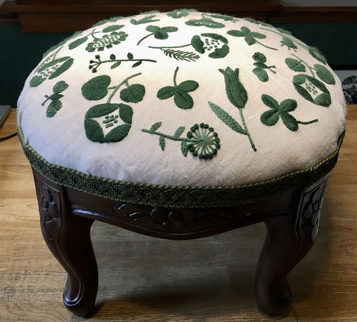 Embroidered footstool